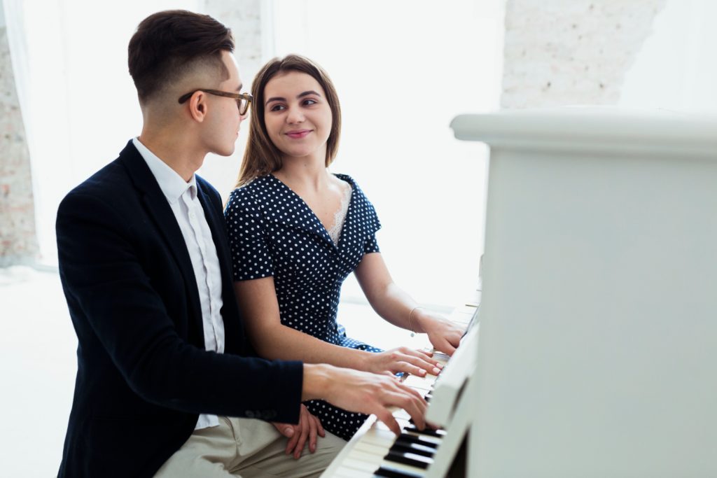 Couple play piano 